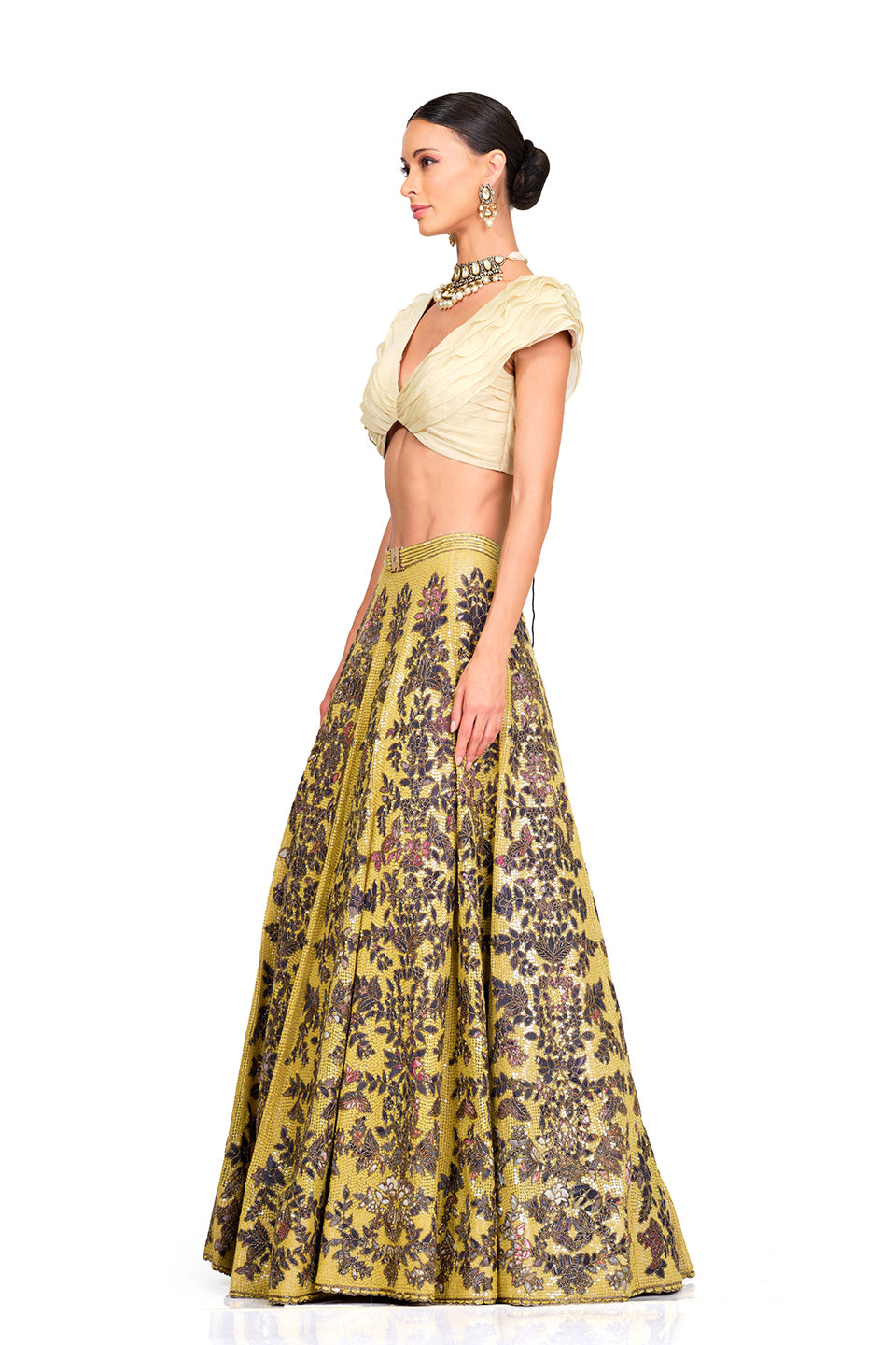 Beige Ruffle Blouse with Heavy Embroidered Sequin Lehenga