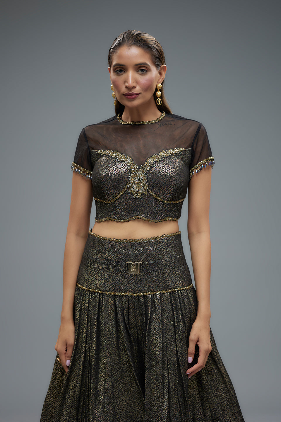 Sheer Blouse And Gold Lehenga Set