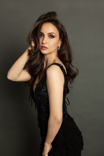 Elli Avram in Black ruffled layered gown