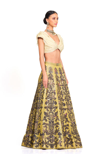 Beige Ruffle Blouse with Heavy Embroidered Sequin Lehenga