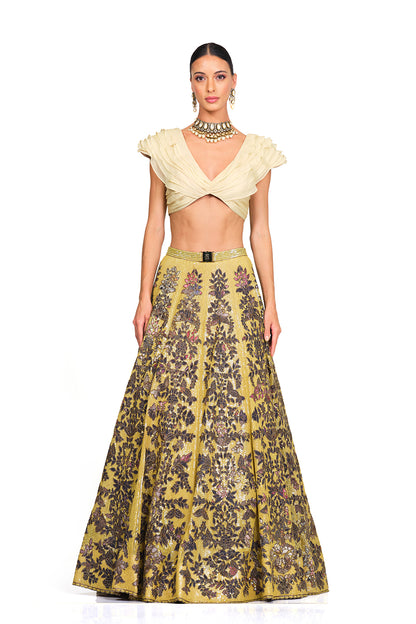 Beige Ruffle Blouse with Heavy Embroidered Sequin Lehenga