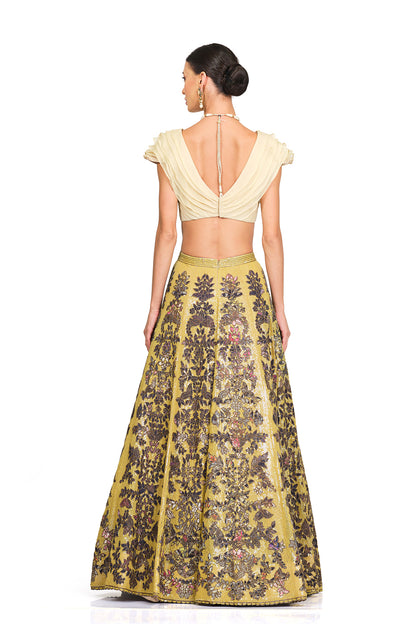 Beige Ruffle Blouse with Heavy Embroidered Sequin Lehenga