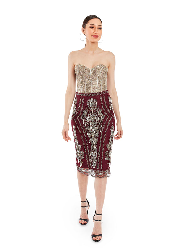 Featuring a maroon pencil skirt in net base and pearl embroidery. A piece you will return to time and again featuring a hem to stop the skirt from the blowing wind.